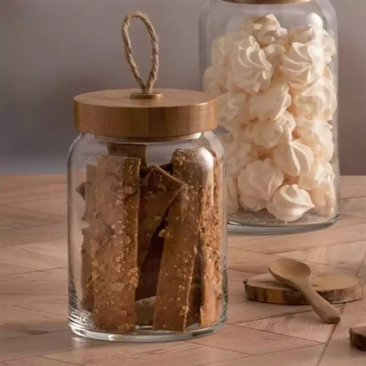 بانکه شیشهای پاشاباغچه مدل وودی کد 43583 با درب چوبی، مناسب نگهداری مواد غذایی خشک مانند برنج، حبوبات و تنقلات